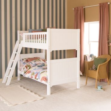 Pure White traditional bunk bed with sloped ladder in room with striped wallpaper