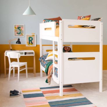 white bunk bed with desk and chair, colourful bedroom with collage art and animal print cushions 