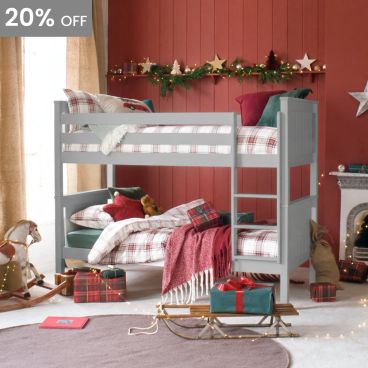 detachable classic beech bunk bed in grey with vehicles and pine chest of drawers.