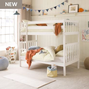 White bunk with ranch style ends and a fitted upright ladder, in a neutral bedroom with orange and blue accessories