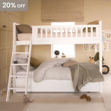 White premium traditional Fargo luxury bunk bed with pitched ladder and trundle underneath, with wardrobe and travel theme accessories