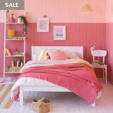 Pink two tone bedroom with white, classic small double bed for children