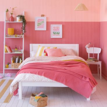 Pink two tone bedroom with white, classic small double bed for children
