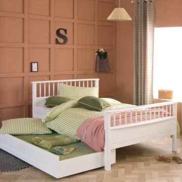 small double bed with trundle pulled out and made up into a bed 