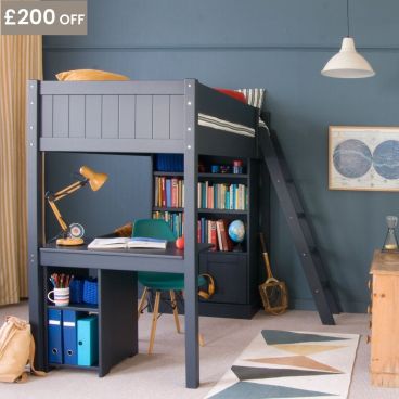 Painswick Blue Loft Bed with storage underneath. Lots of books in bookshelf, planet themed print on wall, pink chest,  and mustard yellow curtains and lamp