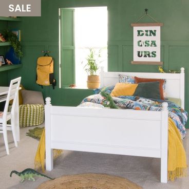 green bedroom with white small double bed for kids and desk and chair 