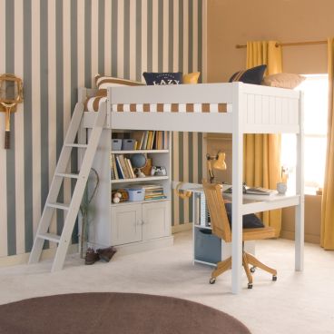 Grey high sleeper loft bed with storage desk and media bookcase underneath, in brown and blue/grey striped bedroom with mustard curtains and vintage sporting accessories.
