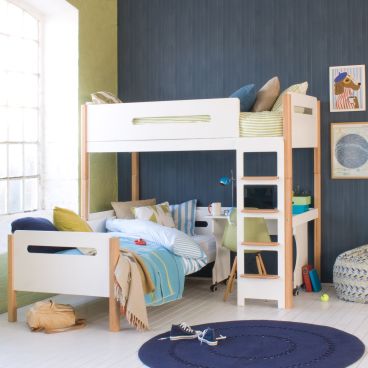 lime and blue bedroom with white and natural beech loft bed, day bed and desk underneath. Large window to the left of the photo