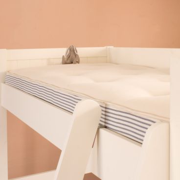 Pocket Sprung high bed mattress on top of high bed, hand tufted, hand made, side ticking, with rabbit sitting on top