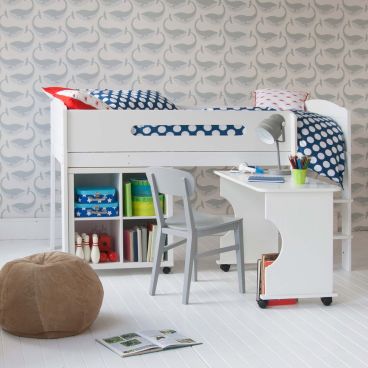 mid sleeper white bed with rolled out desk and storage cube bookcase, with grey whale wallpaper behind