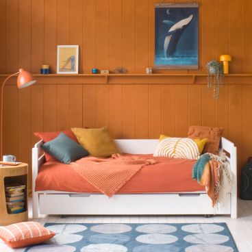 white pill cut out day bed with trundle drawer underneath