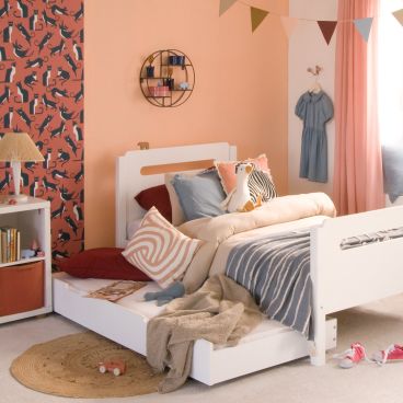 white childrens bed with trundle pulled out and made up as a sleepover bed