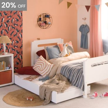 white childrens bed with trundle pulled out and made up as a sleepover bed