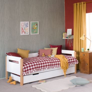 white pill cut out day bed against tongue and groove painted wall