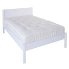 white small double bed with low foot end 