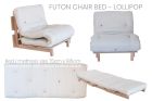 cream futon chair bed with multicoloured buttons