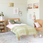 Modern Oak Linus single bed in green and pink girls bedroom with green blanket 