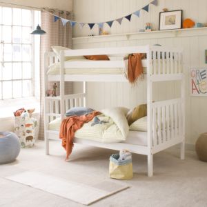White bunk with ranch style ends and a fitted upright ladder, in a neutral bedroom with orange and blue accessories