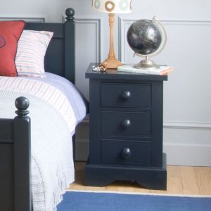 Painswick Blue bedside cabinet for children, in front of duck egg blue panelled bedroom wall and bed