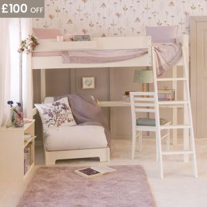 bed with corner desk and futon chair bed underneath, and a bookcase on the end, in a wildflower themed bedroom 