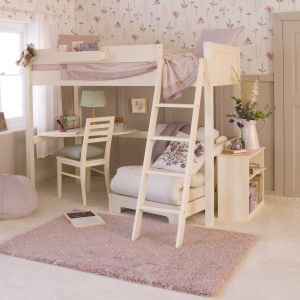 bed with corner desk and futon chair bed underneath, and a bookcase on the end, in a wildflower themed bedroom 