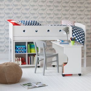 Cubix mid sleeper storage bed for kids with a roll out desk, in front of whale wallpaper