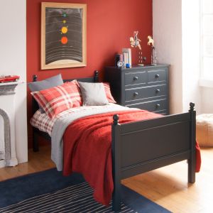Fargo single bed in navy blue, with an oak floor, classic bedroom