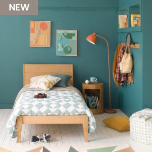 Modern Oak Linus single bed in green and pink girls bedroom with green blanket 