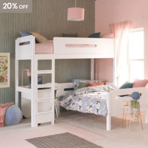 White loft bed with lozenge cut outs, day bed and desk underneath in a pink and green bedroom with blue accessories.