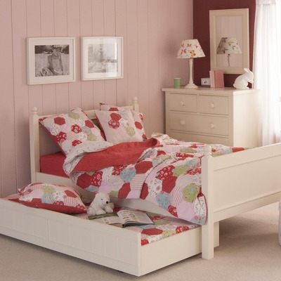 pink patchwork cottage style bedroom for kids 