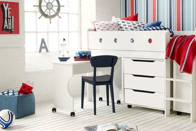 Striped seaside themed bedroom Cubox mid sleeper bed striped wallpaper, white brick wall, white mid sleeper bed with storage, desk and portholes along side