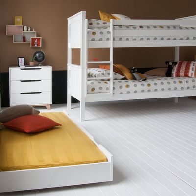 white bunk bed kids room with trundle bed pulled out, brown gender neutral wall 