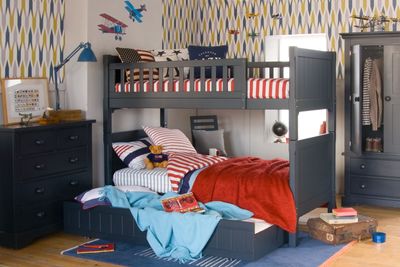 dark blue bunk bed with sleepover trundle, in traditional bedroom 