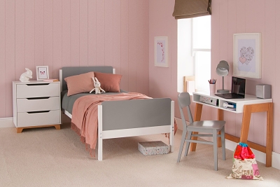 grey rounded bed in pink T&G girls bedroom with desk 