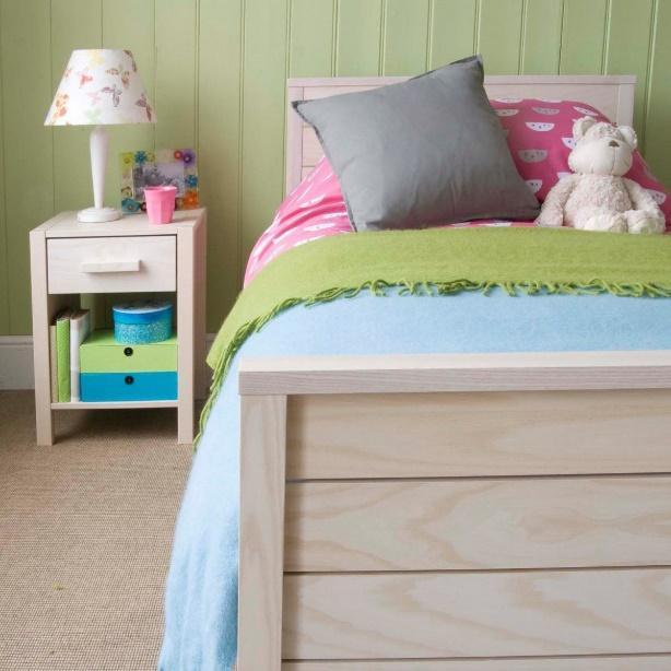 Close up of white wash ash wood grain, in the Woodland range with a bedside table next to it.