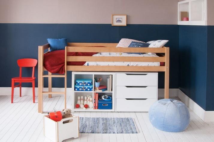 Natural solid beech mid sleeper bed with white storage furniture underneath for saving space