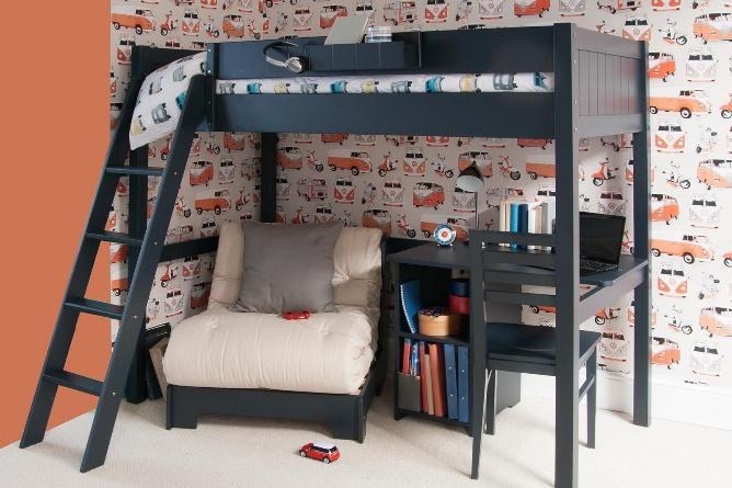 Dark blue loft bed with vw campervans wallpaper, futon chair bed and a storage desk underneath.