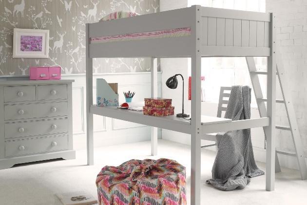 Fargo high sleeper with a full length work top desk and a chest of drawers in the background and woodland wallpaper.